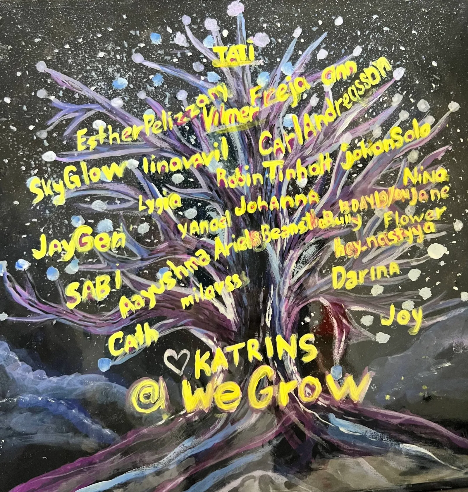 Hand-painted canvas of the WeGrow tree with community members' names written in yellow on the branches around @WeGrow
